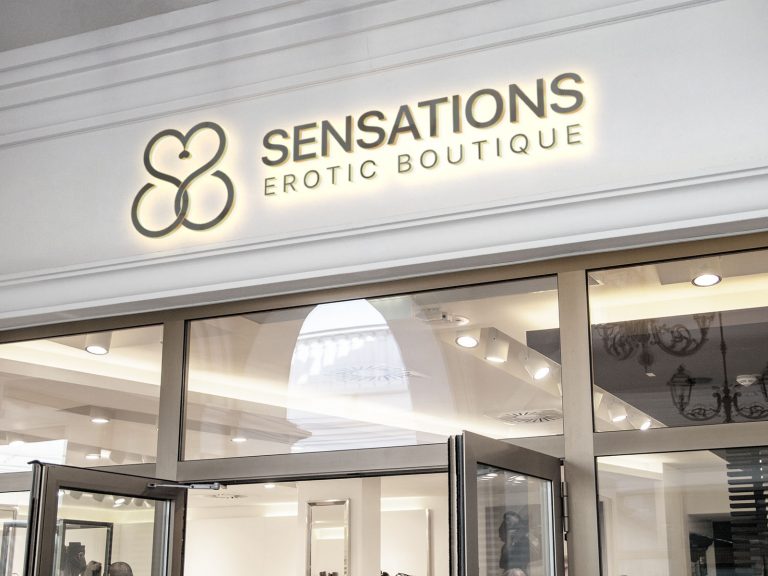 Sensations — storefront with illuminated lettering and flower symbol