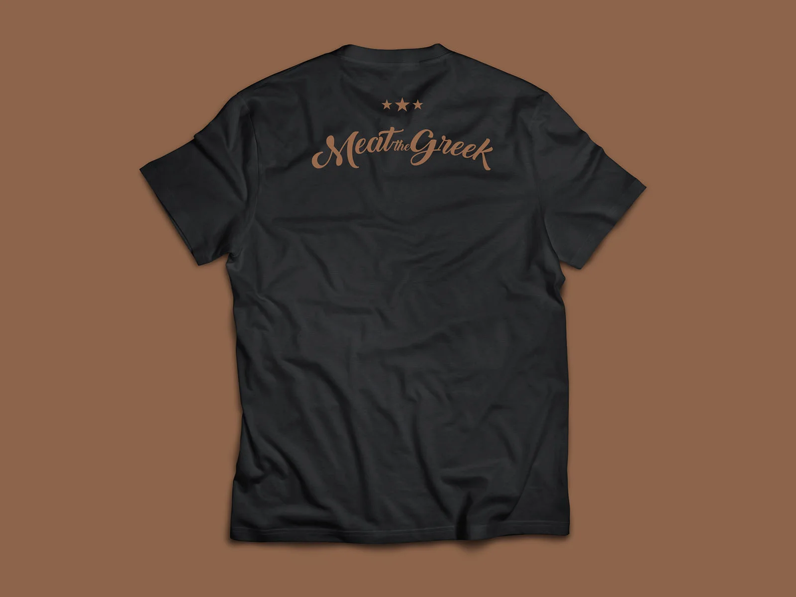 Meat the Greek — black T-shirt, back with the restaurant wordmark