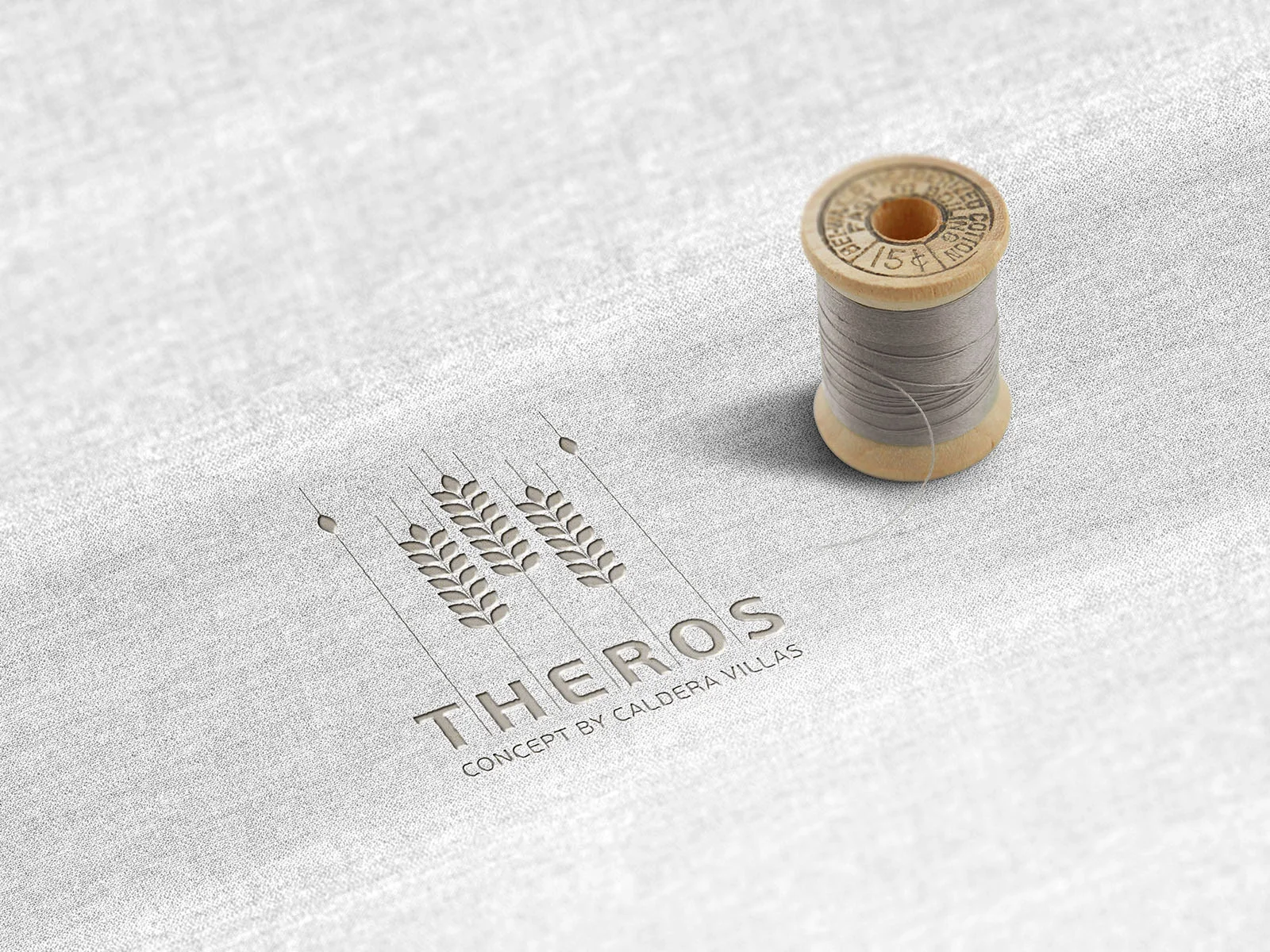 Theros Concept — wheat emblem embroidered on white fabric