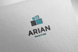 Redesigned Arian Maritime logo in a letterpress mockup on white textured paper
