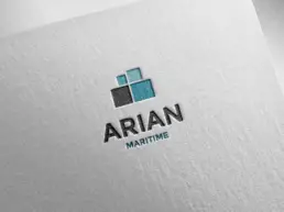 Redesigned Arian Maritime logo in a letterpress mockup on white textured paper