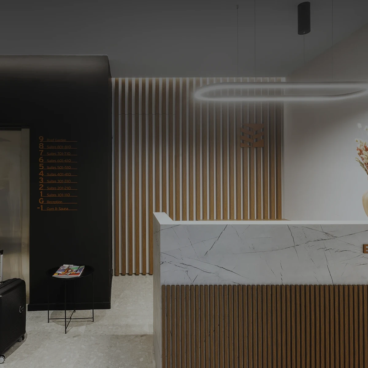 ERMASS logo and signage at the marble reception desk