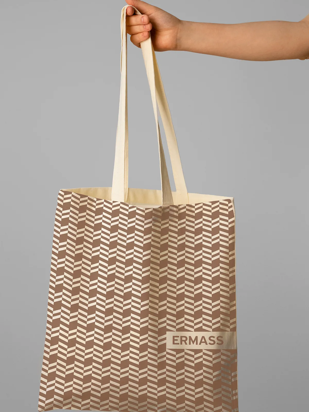 ERMASS tote bag with repeating architectural monogram pattern