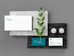 Praxis Pharmacy business cards and envelope with matching visual identity