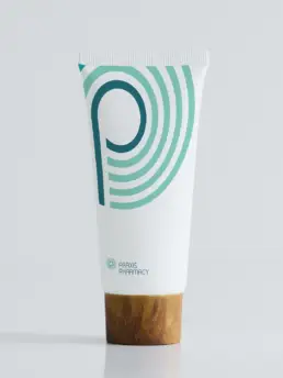Praxis Pharmacy logo and visual identity on a hand cream packaging mockup