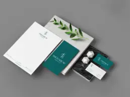Therabeau Pharmacy letterhead and business cards in deep green and white