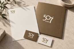 507 Athens identity on a bronze presentation folder, ivory letterhead and business cards