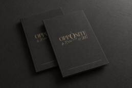 Charcoal restaurant menu cover mockups with the Opposite logo in muted gold foil