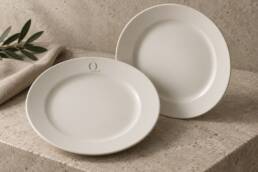 Ivory porcelain plate mockups with the Opposite O monogram in muted gold