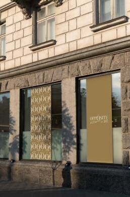 Opposite facade banner mockups with the gold identity and repeated O monogram