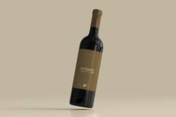 Wine bottle mockup with a muted gold Opposite by Botrini at 507 label