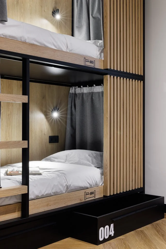 Coordinated bed and storage numbers at Retroverse Hostel