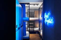 Quest Accepted neon sign in a Retroverse dorm room