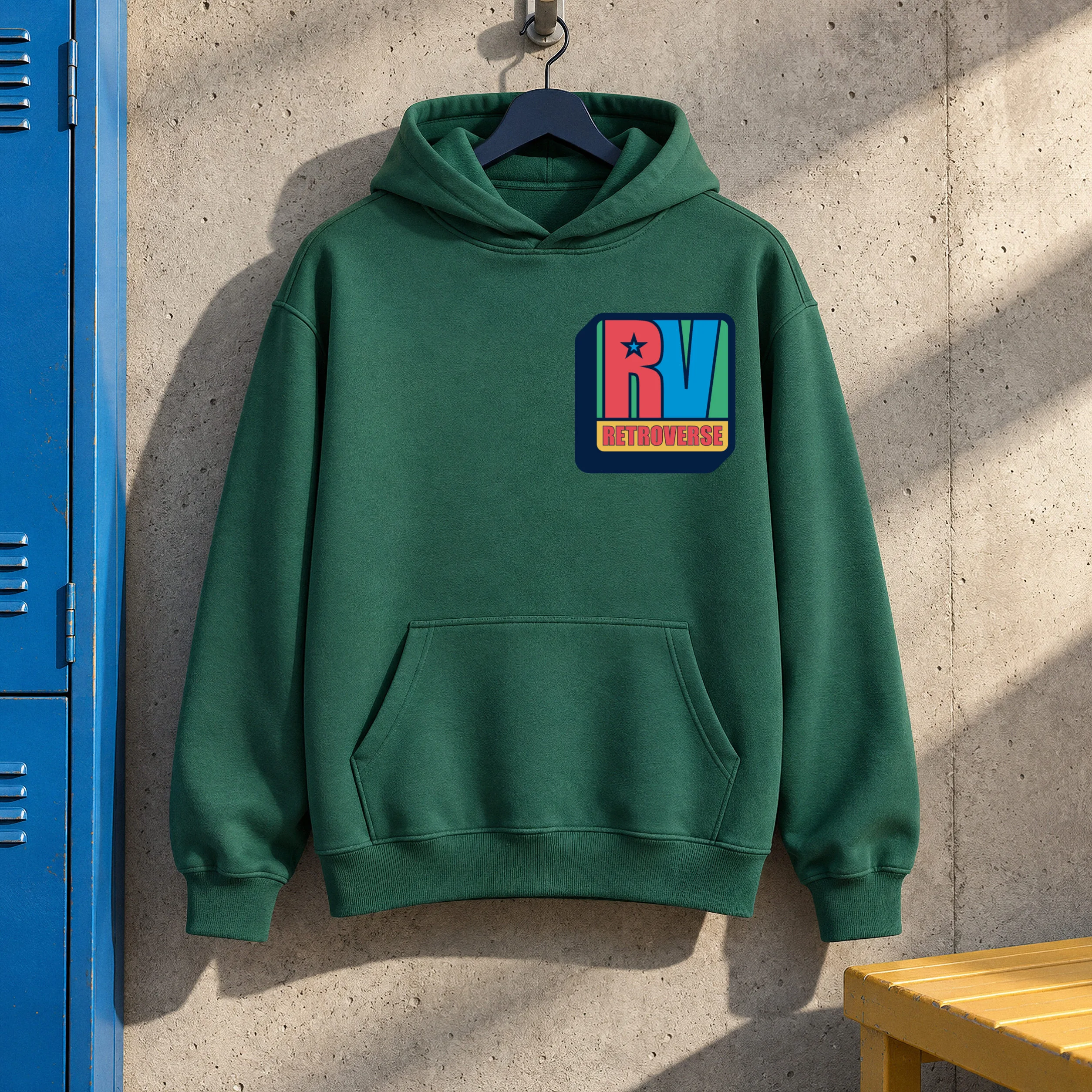 Green hoodie with the original Retroverse RV logo on the chest, against a concrete wall