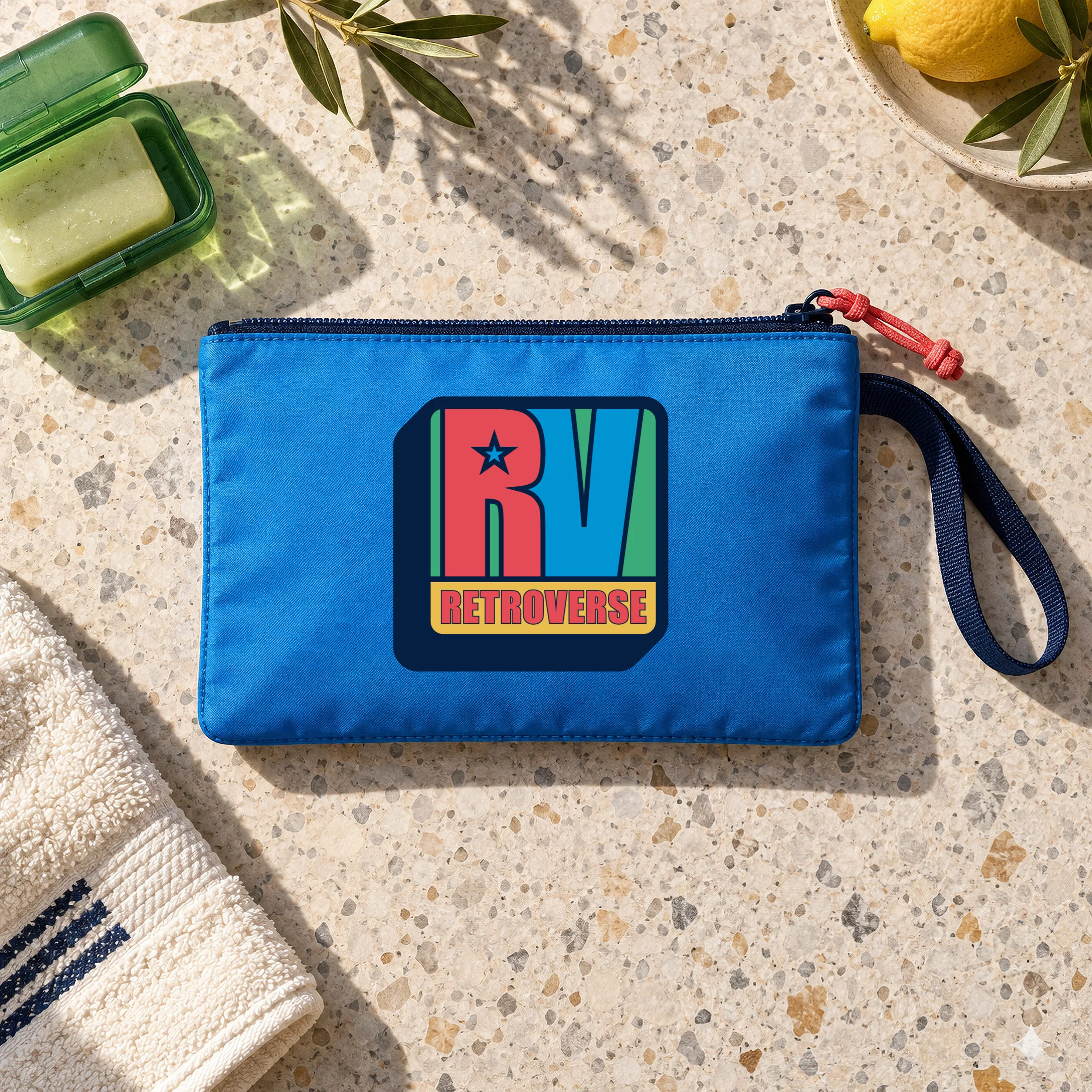 Blue travel pouch with the original Retroverse RV logo and red zipper pull