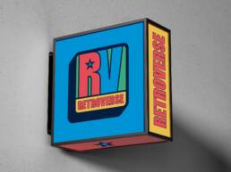 Retroverse exterior lightbox sign with the colourful RV logo and vertical Retroverse lettering
