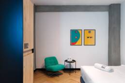 Retroverse graphic posters in a private guest room